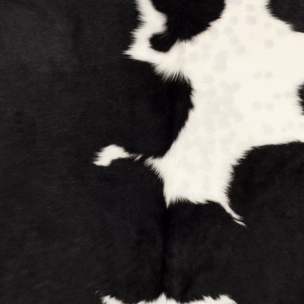 Cow Hide Black/White 5 ft. x 7 ft. Animal Print Area Rug by SAFAVIEH 6 Cow Hide Black/White 5 ft. x 7 ft. Animal Print Area Rug by SAFAVIEH - Image 6