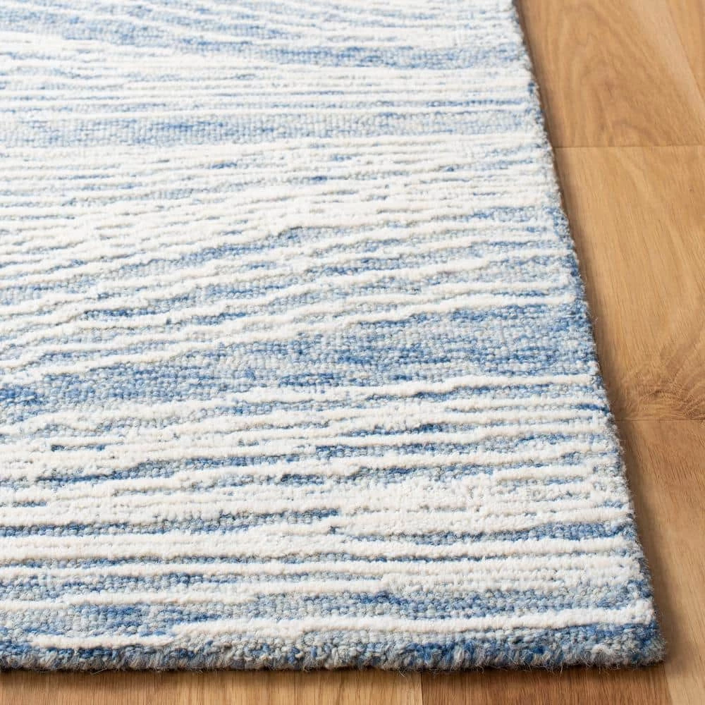 Metro Blue/Ivory 8 ft. x 10 ft. Abstract Waves Area Rug by SAFAVIEH 9 Metro Blue/Ivory 8 ft. x 10 ft. Abstract Waves Area Rug by SAFAVIEH - Image 9