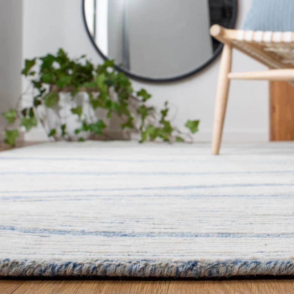 Metro Blue/Ivory 8 ft. x 10 ft. Abstract Waves Area Rug by SAFAVIEH 4 Metro Blue/Ivory 8 ft. x 10 ft. Abstract Waves Area Rug by SAFAVIEH - Image 4