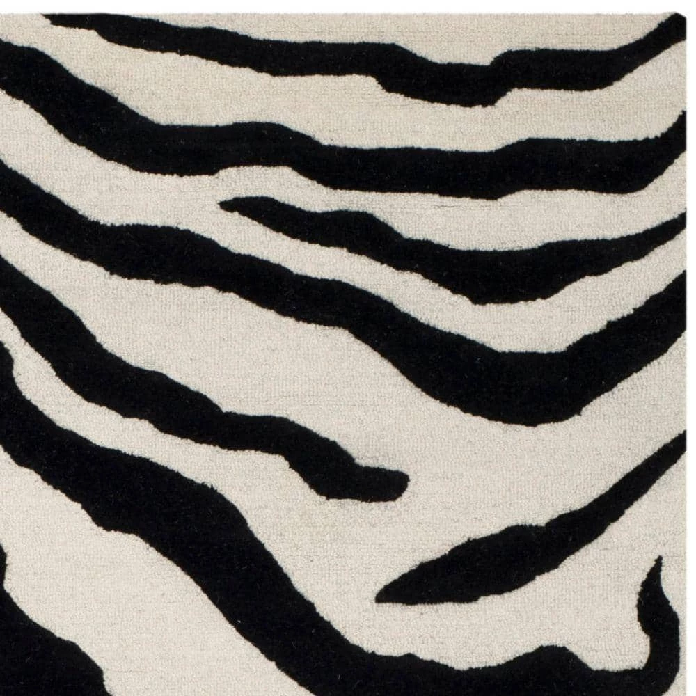 Cambridge Ivory/Black 8 ft. x 10 ft. Area Rug by SAFAVIEH 5 Cambridge Ivory/Black 8 ft. x 10 ft. Area Rug by SAFAVIEH - Image 5