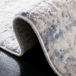 Amelia Ivory/Blue 9 ft. x 12 ft. Abstract Distressed Area Rug by SAFAVIEH -SAFAVIEH Shop ivory blue safavieh area rugs ala700a 9 1f 1000