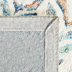 Capri Ivory/Blue 9 ft. x 12 ft. Geometric Leaf Area Rug by SAFAVIEH 12 Capri Ivory/Blue 9 ft. x 12 ft. Geometric Leaf Area Rug by SAFAVIEH -SAFAVIEH Shop ivory blue safavieh area rugs cpr208a 9 1f 1000