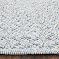 Montauk Ivory/Light Blue 8 ft. x 10 ft. Solid Area Rug by SAFAVIEH 11 Montauk Ivory/Light Blue 8 ft. x 10 ft. Solid Area Rug by SAFAVIEH -SAFAVIEH Shop ivory light blue safavieh area rugs mtk716b 8 1d 1000