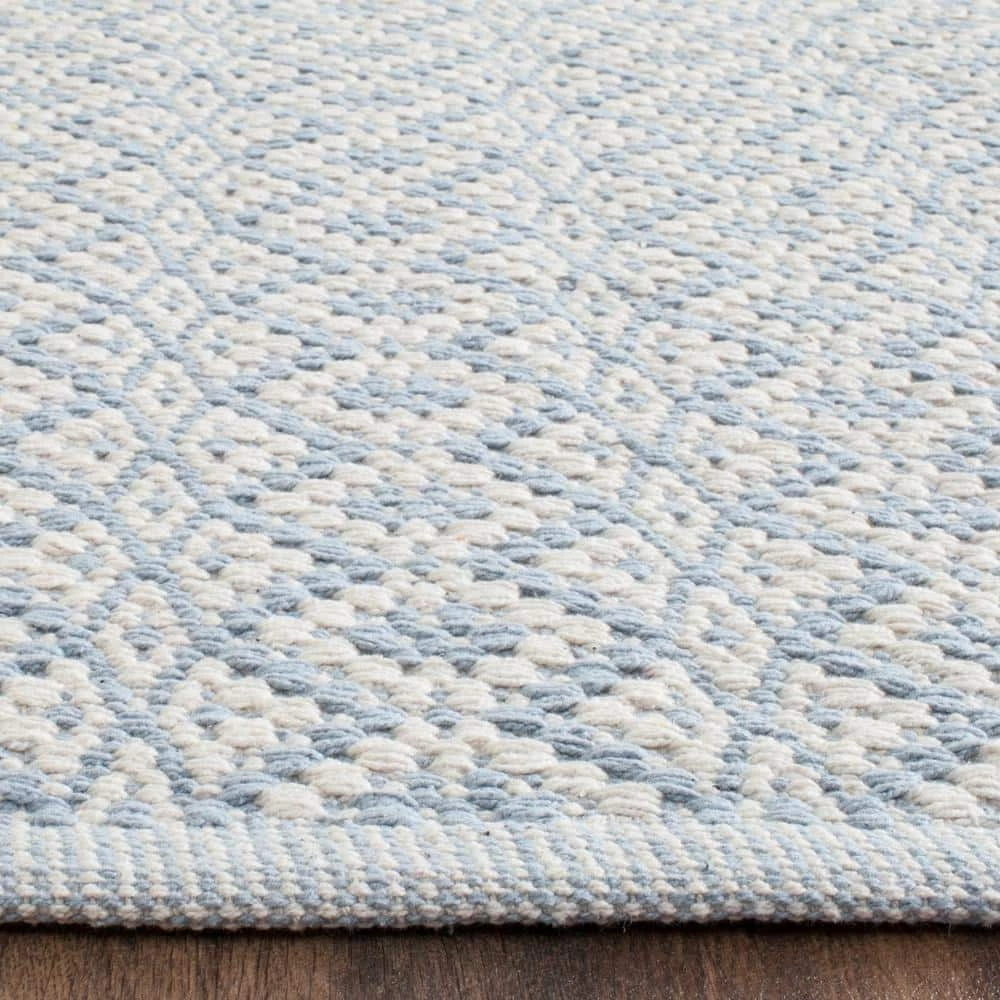 Montauk Ivory/Light Blue 8 ft. x 10 ft. Solid Area Rug by SAFAVIEH 4 Montauk Ivory/Light Blue 8 ft. x 10 ft. Solid Area Rug by SAFAVIEH - Image 4