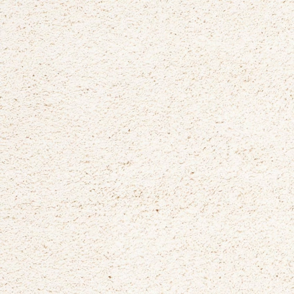 Milan Shag Ivory 8 ft. x 10 ft. Solid Area Rug by SAFAVIEH 6 Milan Shag Ivory 8 ft. x 10 ft. Solid Area Rug by SAFAVIEH - Image 6