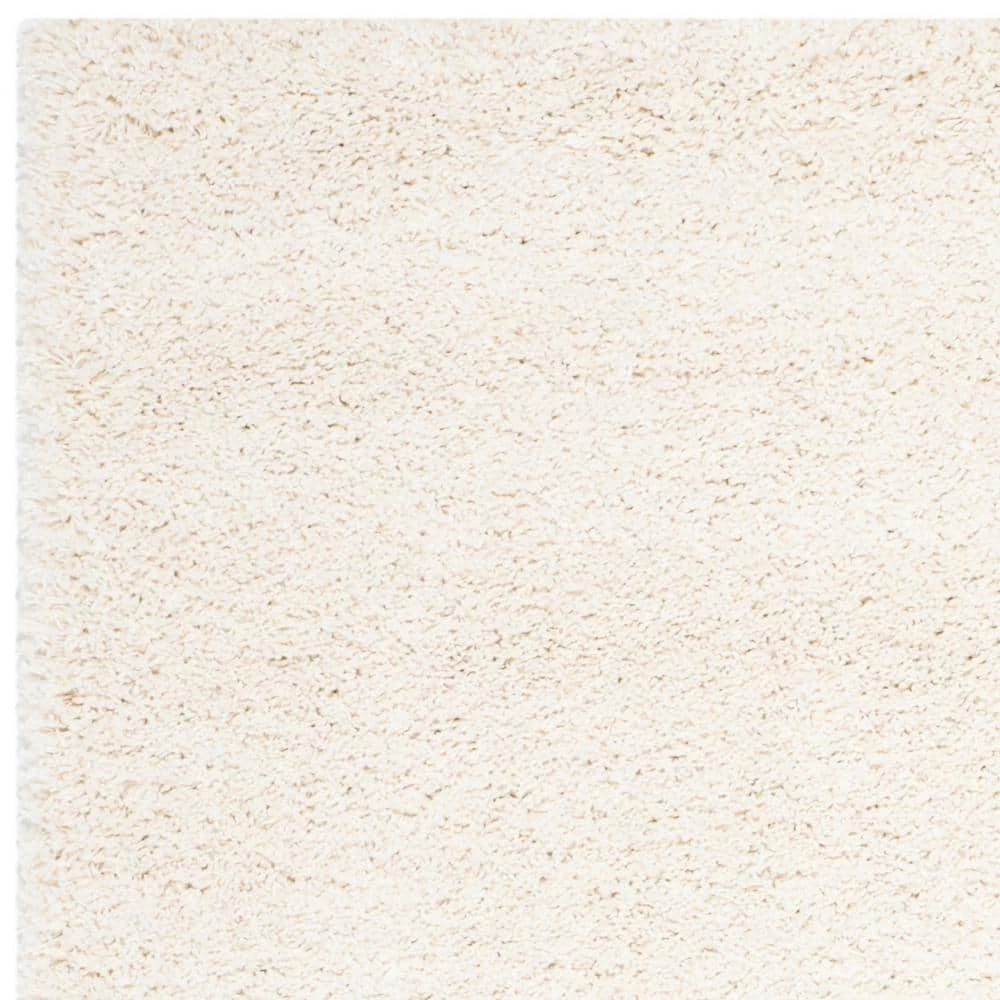 Milan Shag Ivory 8 ft. x 10 ft. Solid Area Rug by SAFAVIEH 7 Milan Shag Ivory 8 ft. x 10 ft. Solid Area Rug by SAFAVIEH - Image 7