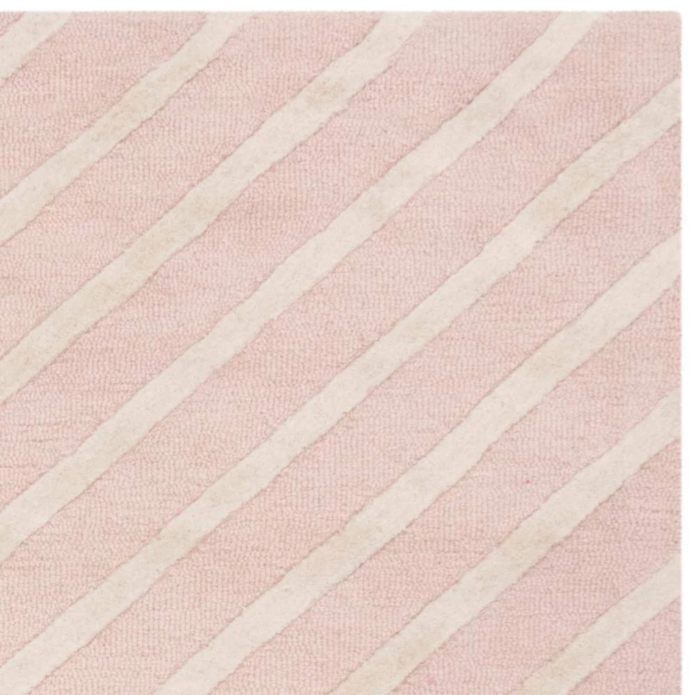 Kids Pink/Ivory 5 ft. x 7 ft. Geometric Area Rug by SAFAVIEH 7 Kids Pink/Ivory 5 ft. x 7 ft. Geometric Area Rug by SAFAVIEH - Image 7