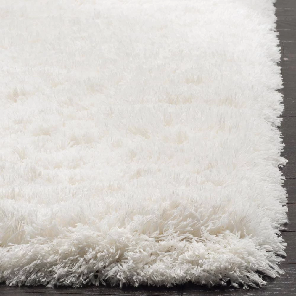 Polar Shag White 7 ft. x 9 ft. Solid Area Rug by SAFAVIEH 4 Polar Shag White 7 ft. x 9 ft. Solid Area Rug by SAFAVIEH - Image 4